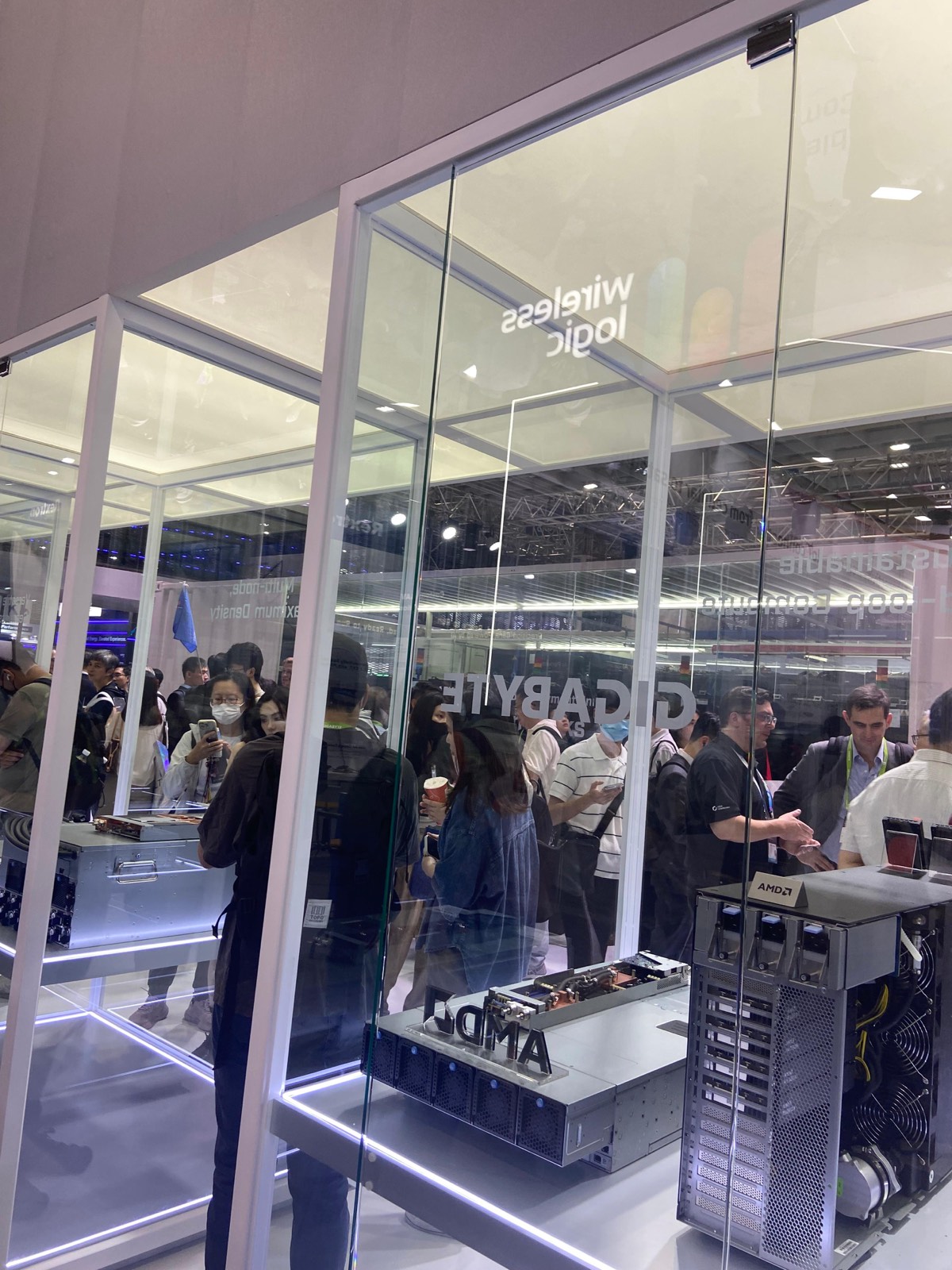 Gigabyte and AMD booth behind glass