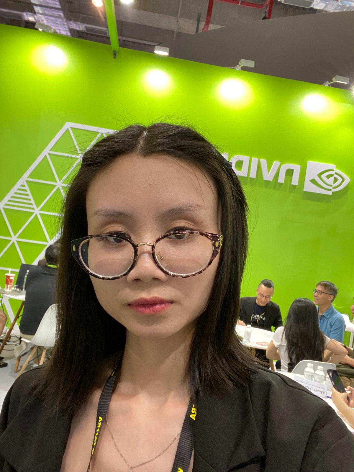 In front of the green NVIDIA wall